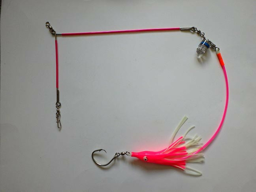 UV spreader bar rigged with UV/pink glow octosquid leaderwith scent tube  and blue water activated light